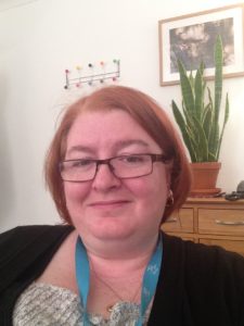 Photo of Siobhan Toner, female person centred counsellor who works with clients online. She is white, round faced and wearing glasses and her hair is ginger and cut in a bob. 